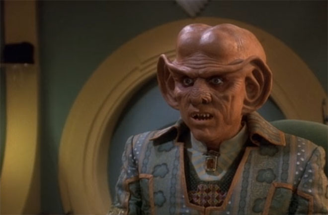 Quark, with more of those weird Ferengi towels lurking behind him.